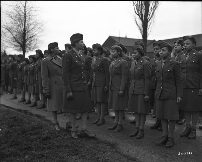 Two Women's Army Corps Officers inspect the 6888th Central Postal Directory Battalion