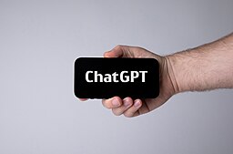 hand holding phone with chatgpt on screen