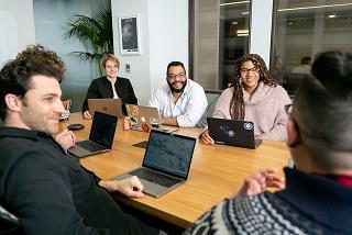 A group of people sitting around a table