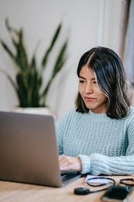 yes! confident young lady at a laptop